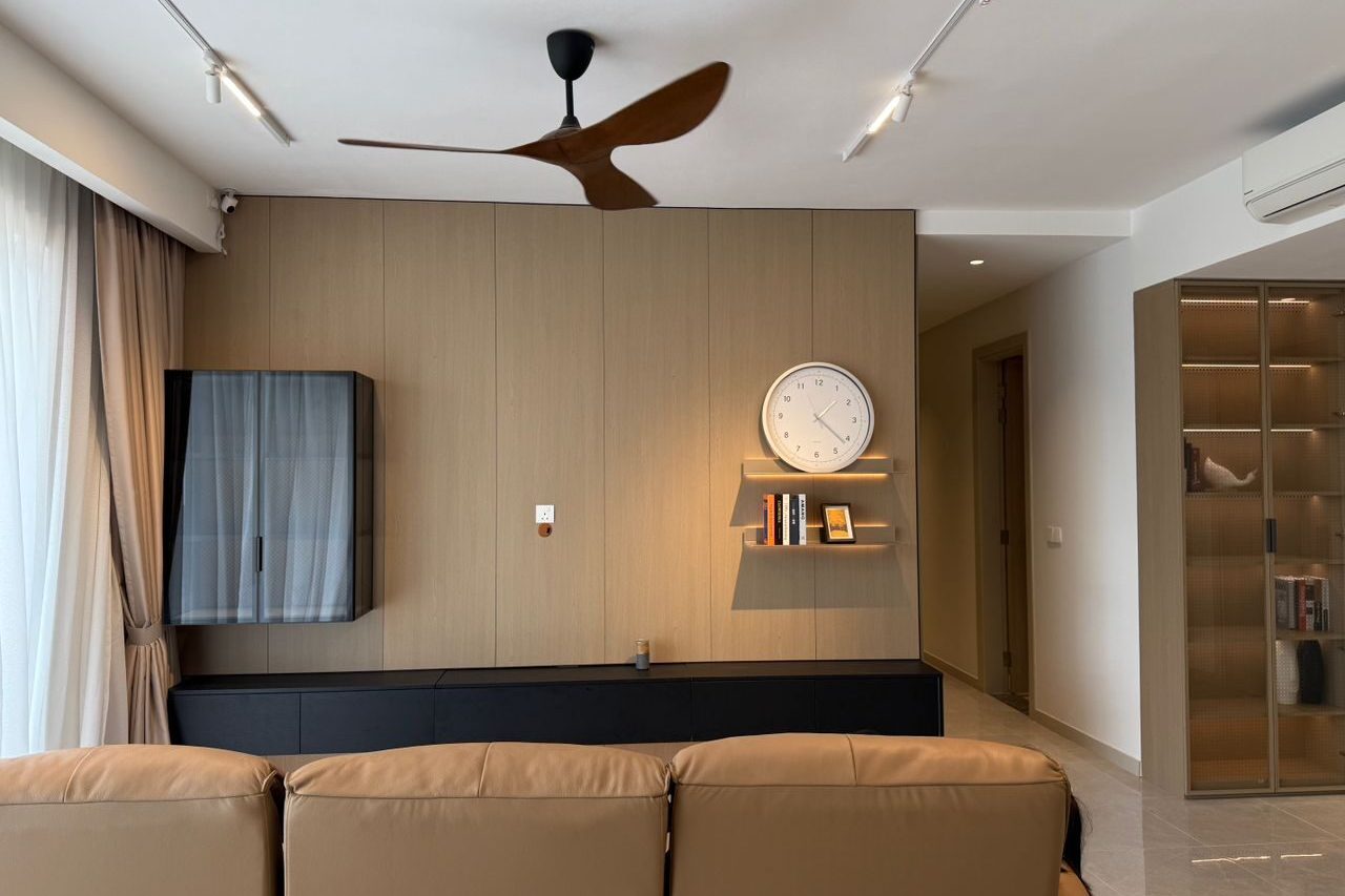 Living room with a timber-panelled feature wall, low black console, wall-hung glass cabinet and tall glass display cabinet in a Sunpina home